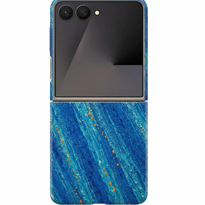 Inspiring Phone Cases Cobalt Drift phone case for Samsung Galaxy Z Flip with blue abstract strokes and orange accents.
