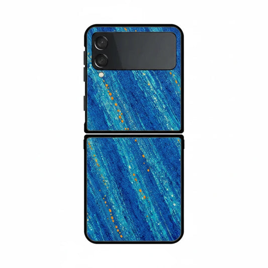Inspiring Phone Cases Cobalt Drift Samsung Galaxy Z Flip case with blue abstract strokes and orange accent flecks.